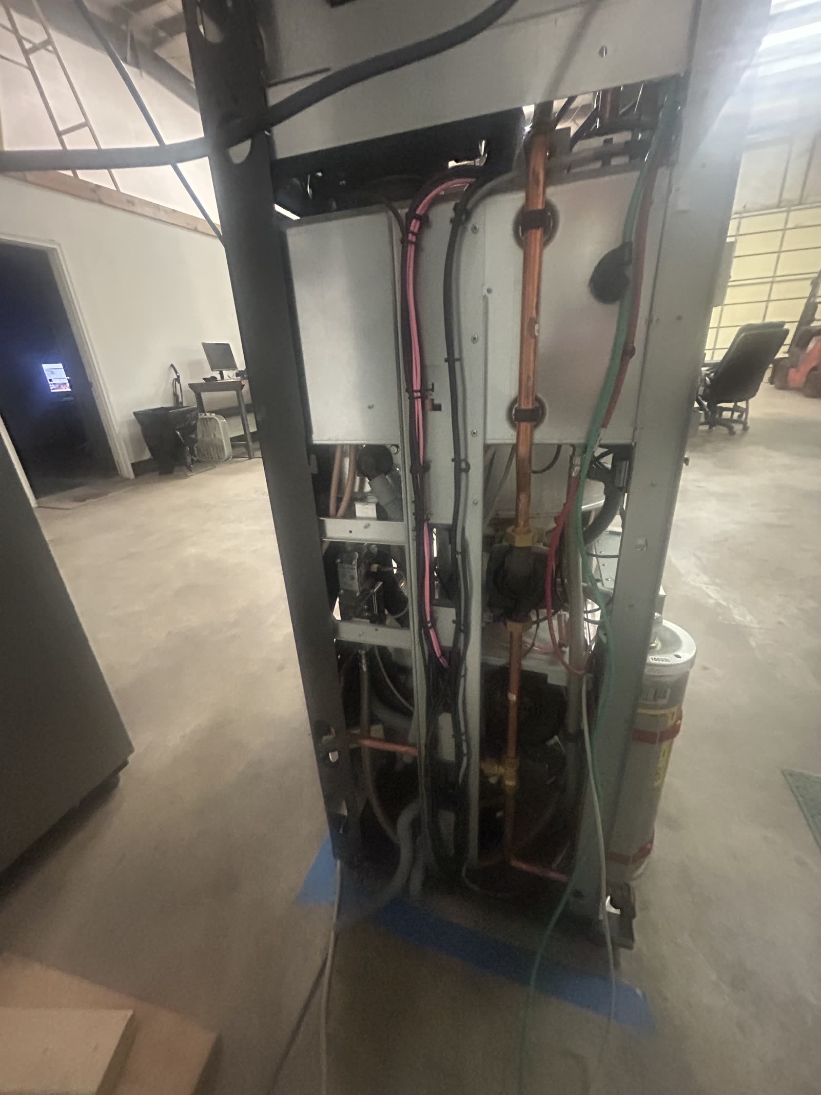 Flux Home unit internal view, front panel removed, showing pressure vessel and control board